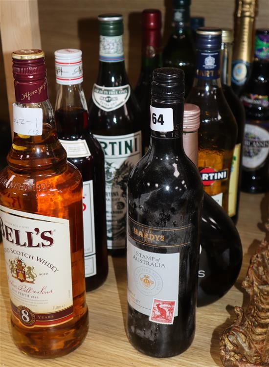 Twelve assorted spirits etc. including Bells whisky, Martini, Sherry and Pimms.